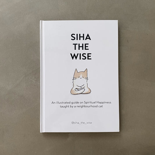 Book on spirituality with cat